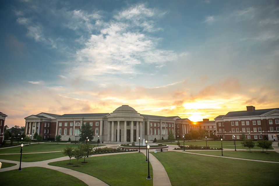 Long shot of sunset and the Engineering quad building in background