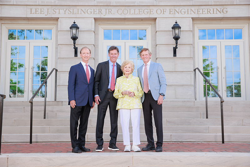 professor in blue backlit lab